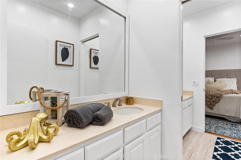 2804 West Oceanfront Newport Beach, CA 92663 - Photo 22 of 41 a bedroom with a bed and wooden floor