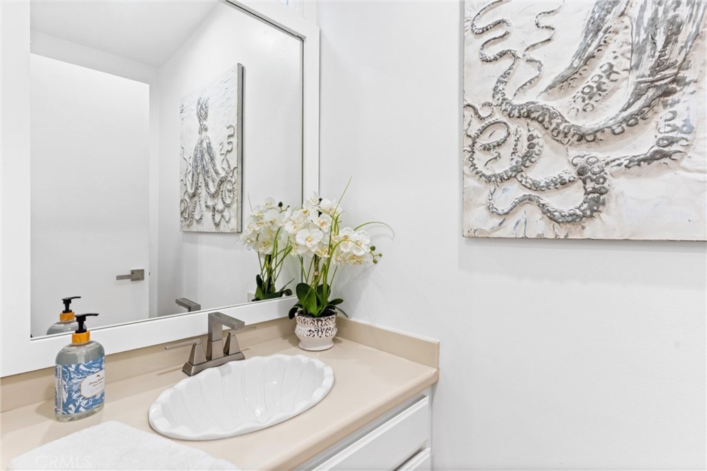 2804 West Oceanfront Newport Beach, CA 92663 - Photo 23 of 41 a bathroom with a sink and a mirror