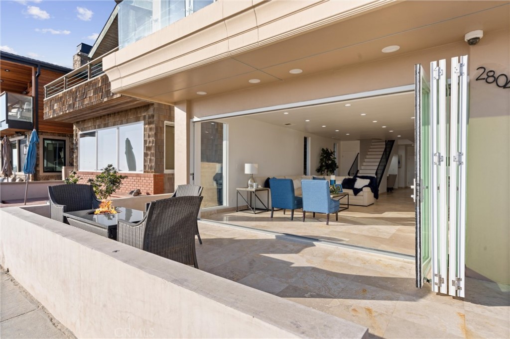 2804 West Oceanfront Newport Beach, CA 92663 - Photo 30 of 41 a view of a lobby with table and chair