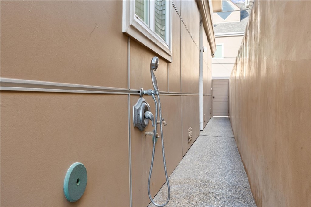 2804 West Oceanfront Newport Beach, CA 92663 - Photo 31 of 41 a view of a hallway with wooden floor and staircase