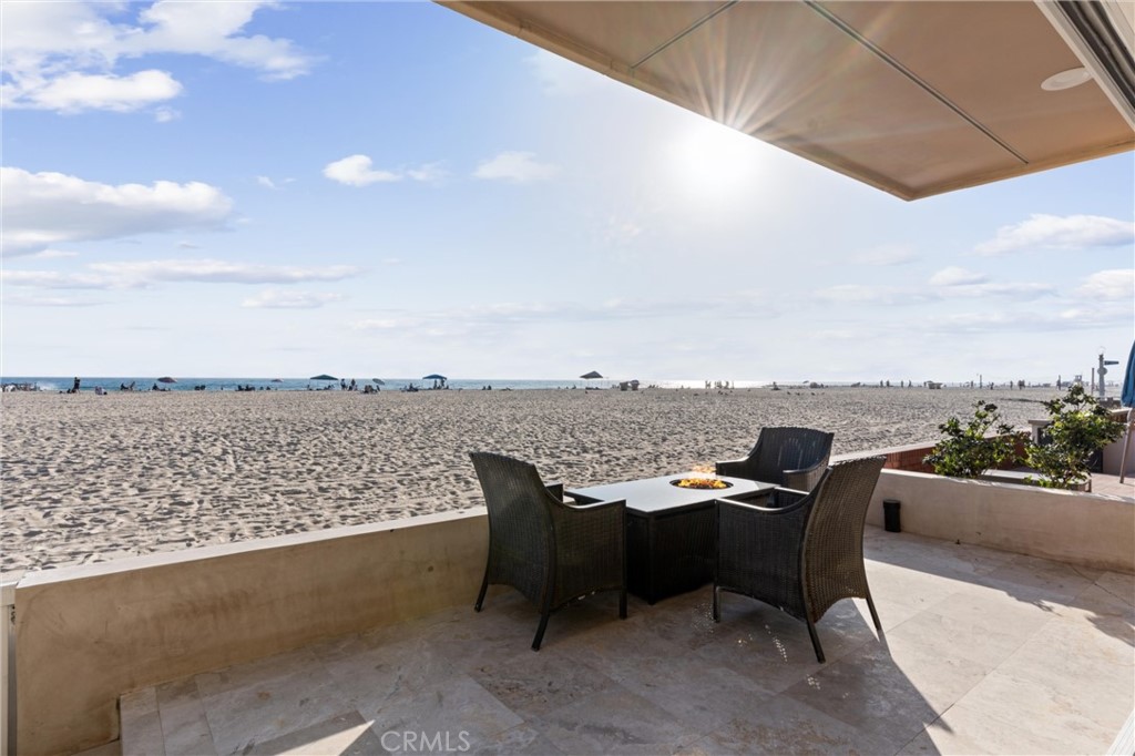 2804 West Oceanfront Newport Beach, CA 92663 - Photo 34 of 41 a view of a terrace with furniture