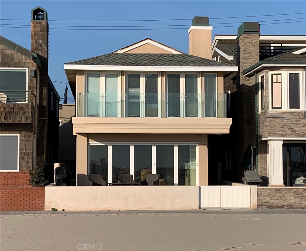 2804 West Oceanfront Newport Beach, CA 92663 - Photo 35 of 41 a front view of a house with a yard