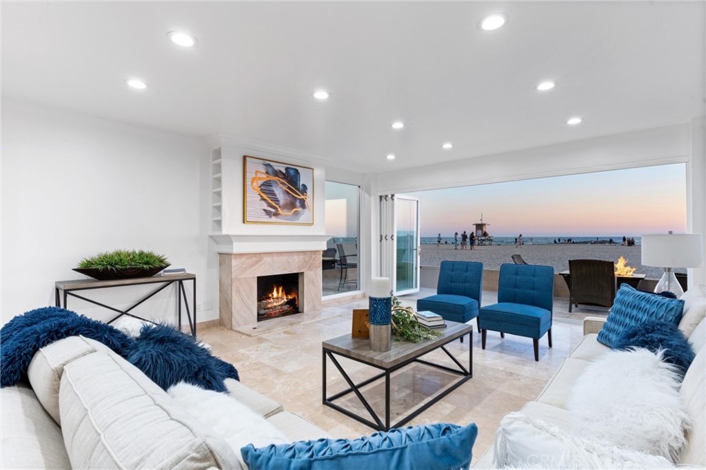 2804 West Oceanfront Newport Beach, CA 92663 - Photo 41 of 41 a living room with furniture and a fireplace