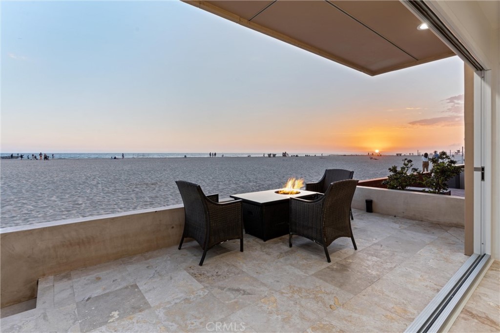 2804 West Oceanfront Newport Beach, CA 92663 - Photo 6 of 41 a view of a terrace with furniture and a terrace