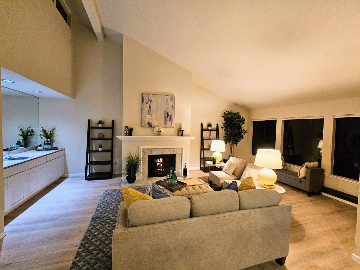 40 Shepherds Knoll Road, Unit 40 Monterey, CA 93940 - Photo 13 of 52 a living room with furniture a flat screen tv and a fireplace