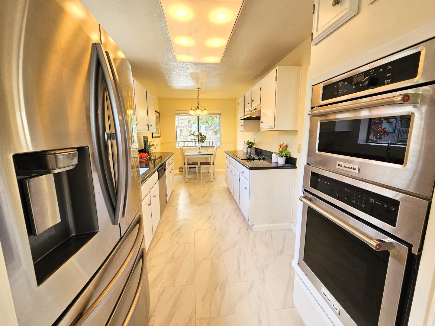 40 Shepherds Knoll Road, Unit 40 Monterey, CA 93940 - Photo 26 of 52 a kitchen with stainless steel appliances a stove microwave and refrigerator
