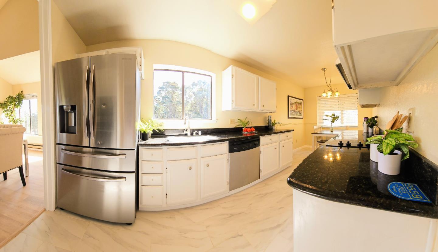 40 Shepherds Knoll Road, Unit 40 Monterey, CA 93940 - Photo 27 of 52 a kitchen with a refrigerator and white cabinets