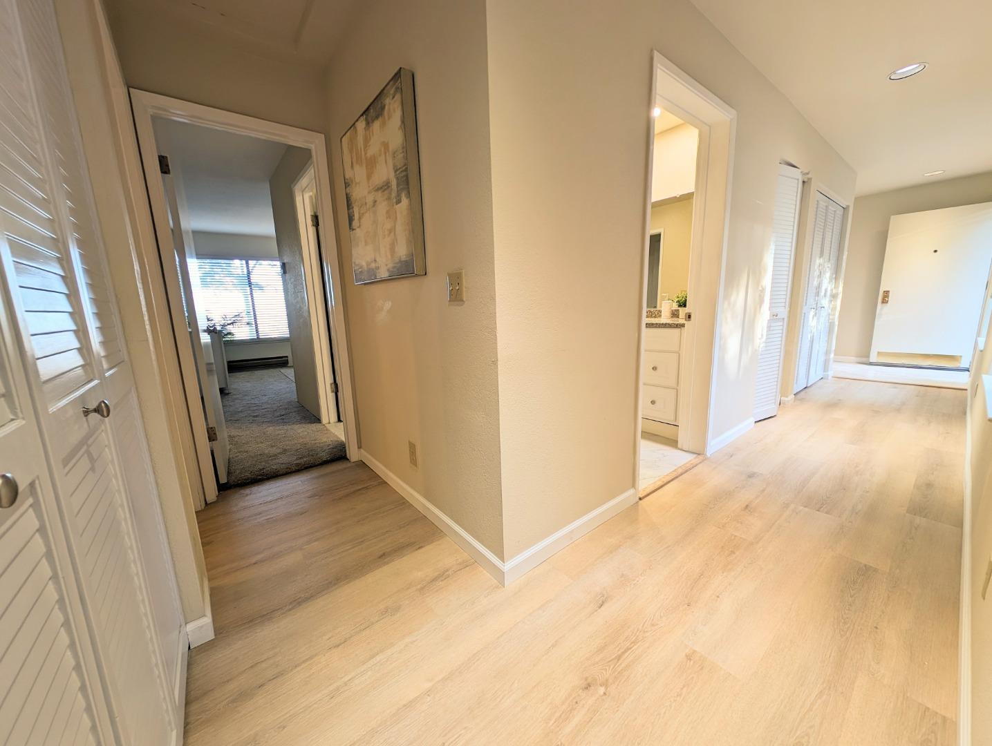 40 Shepherds Knoll Road, Unit 40 Monterey, CA 93940 - Photo 32 of 52 a view of a hallway with wooden floor and a living room