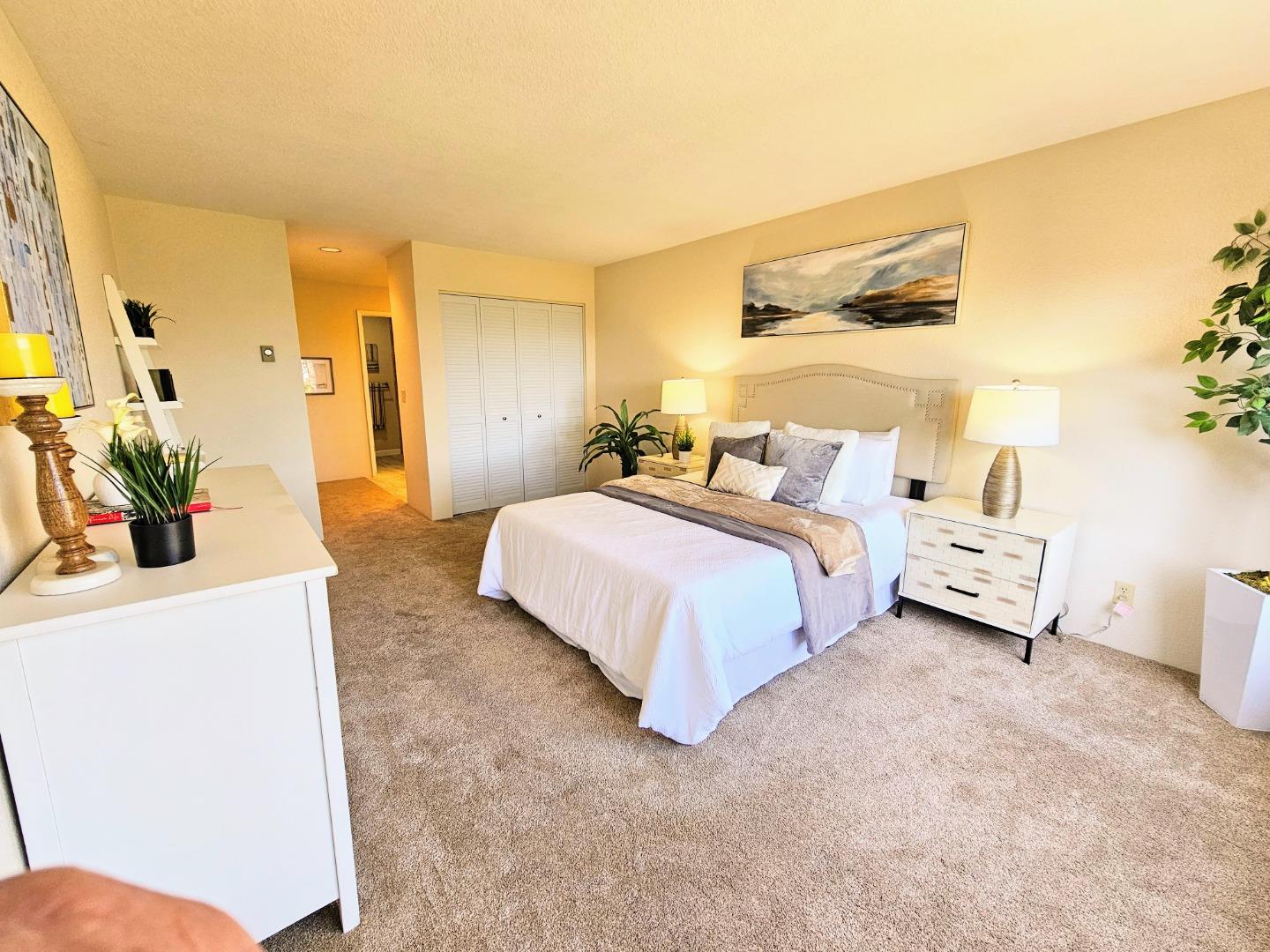 40 Shepherds Knoll Road, Unit 40 Monterey, CA 93940 - Photo 39 of 52 a bedroom with a bed and a potted plant