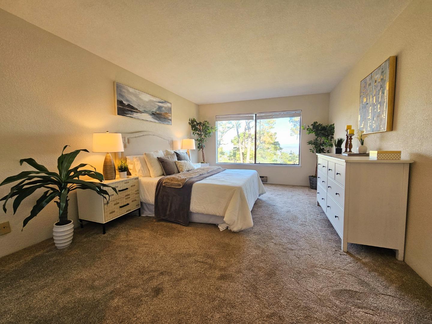 40 Shepherds Knoll Road, Unit 40 Monterey, CA 93940 - Photo 41 of 52 a spacious bedroom with a bed and a couch