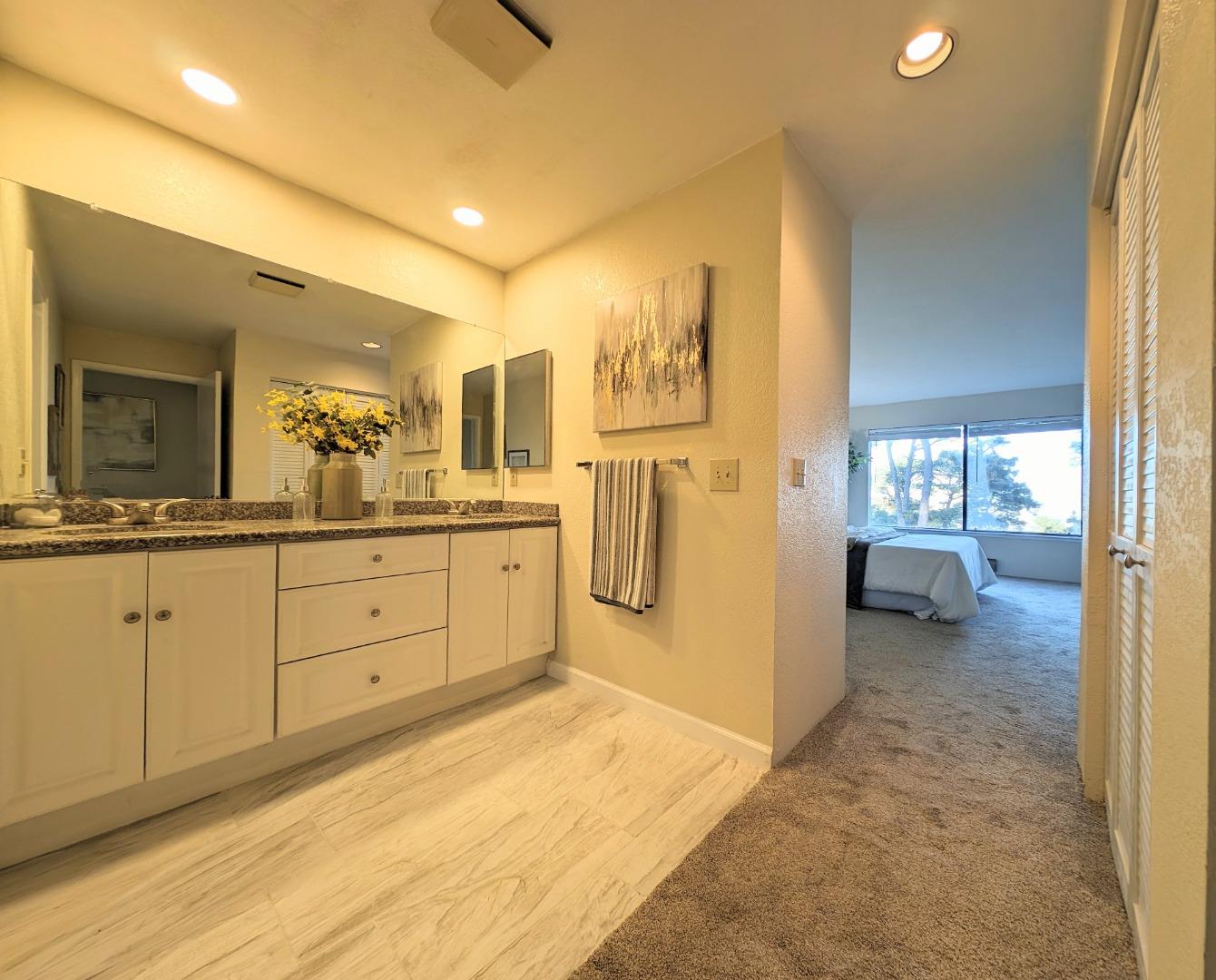 40 Shepherds Knoll Road, Unit 40 Monterey, CA 93940 - Photo 47 of 52 a bathroom with a sink a mirror and a shower