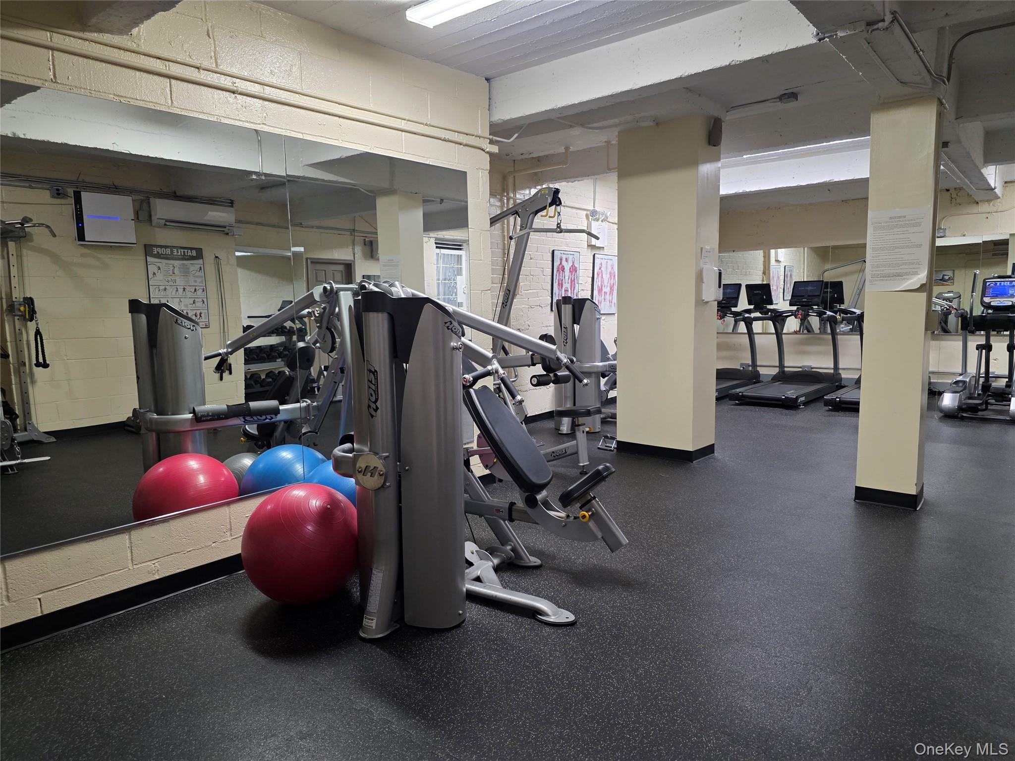 84-01 Main Street, Unit 506 Queens, NY 11435 - Photo 23 of 25 a view of a room with gym equipment