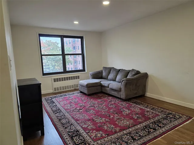 a living room with a couch and a rug