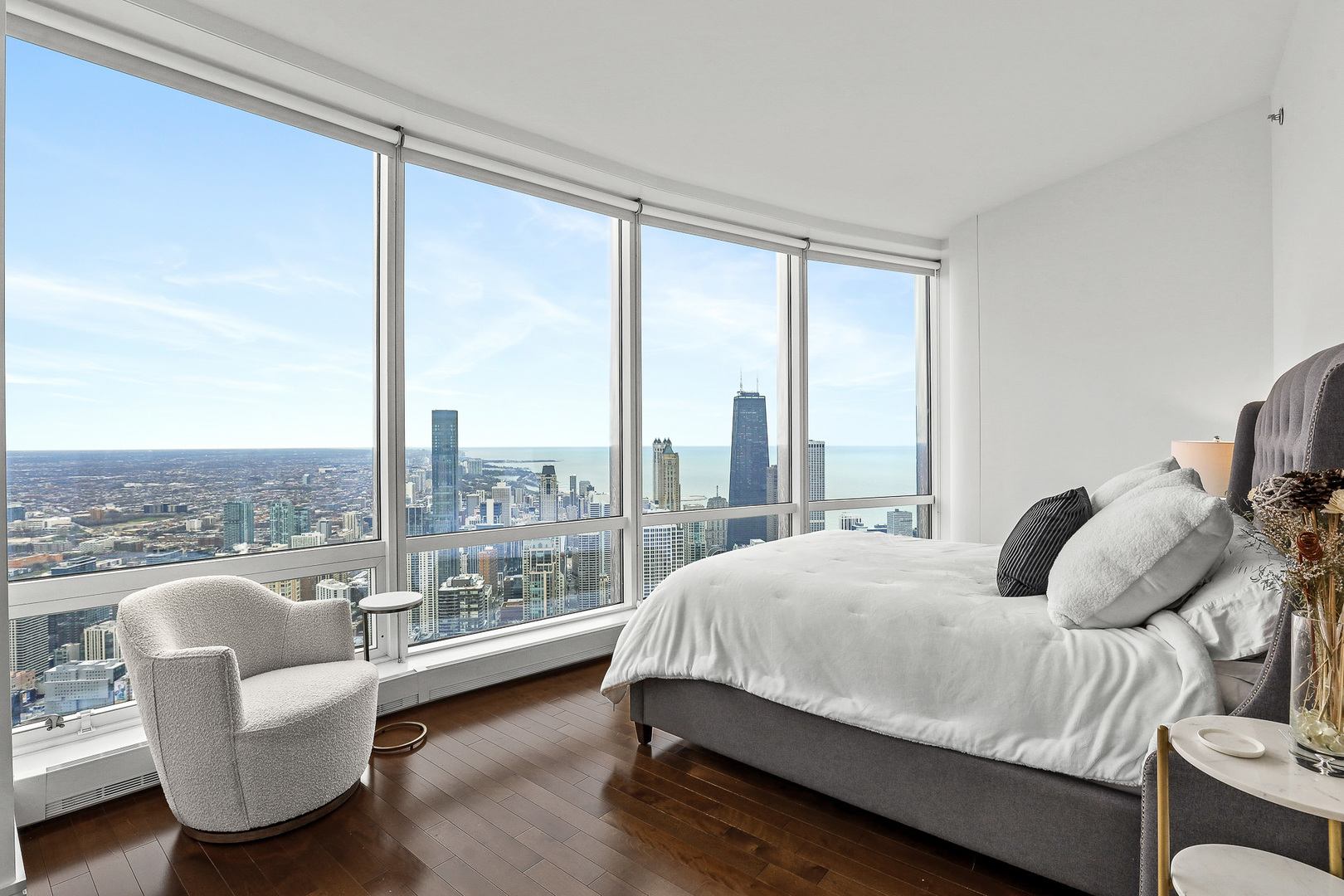 401 North Wabash Avenue, Unit 66A Chicago, IL 60611 - Photo 12 of 26 a bedroom with furniture and a large window