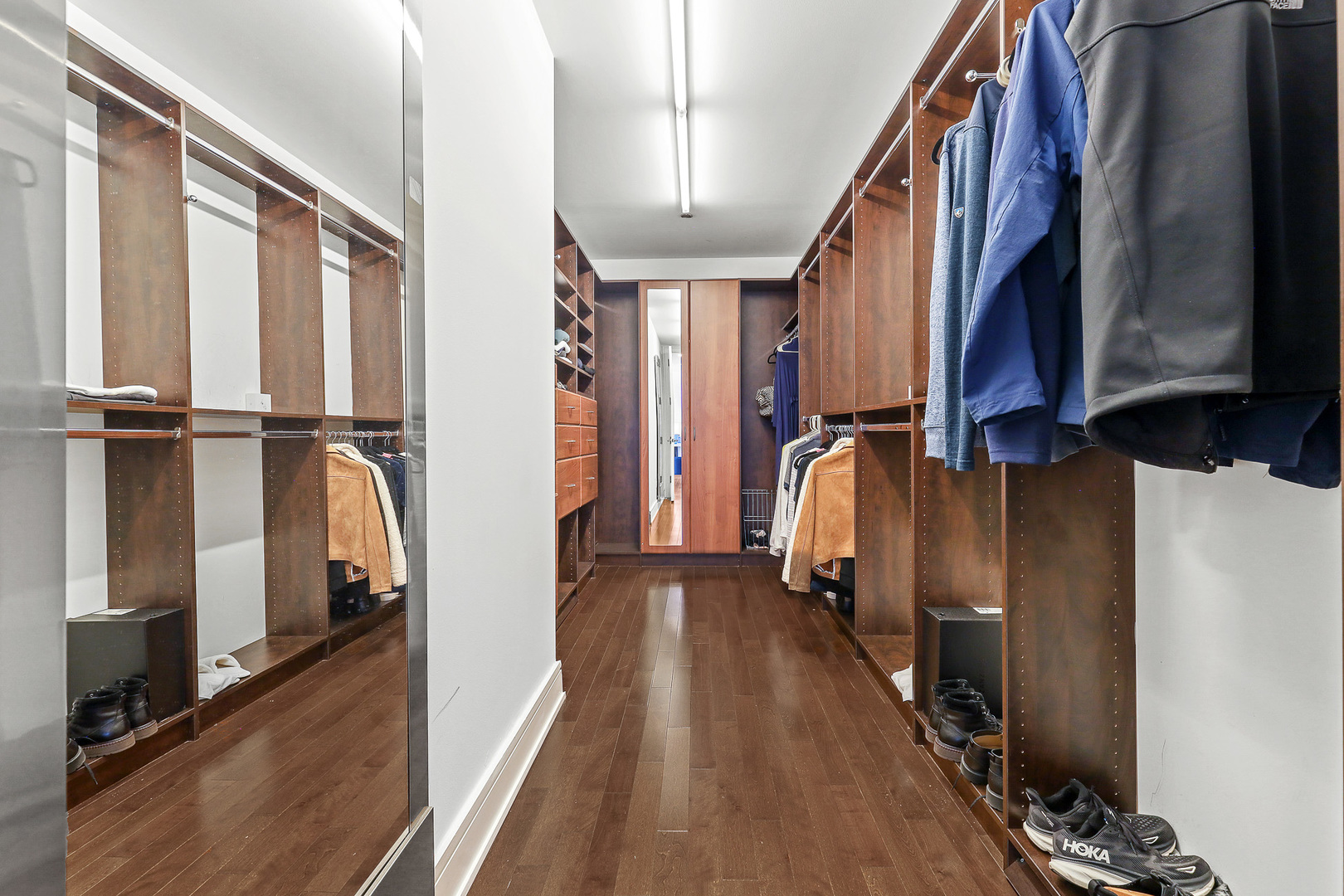 401 North Wabash Avenue, Unit 66A Chicago, IL 60611 - Photo 24 of 26 a view of walk in closet with clothes and shoes