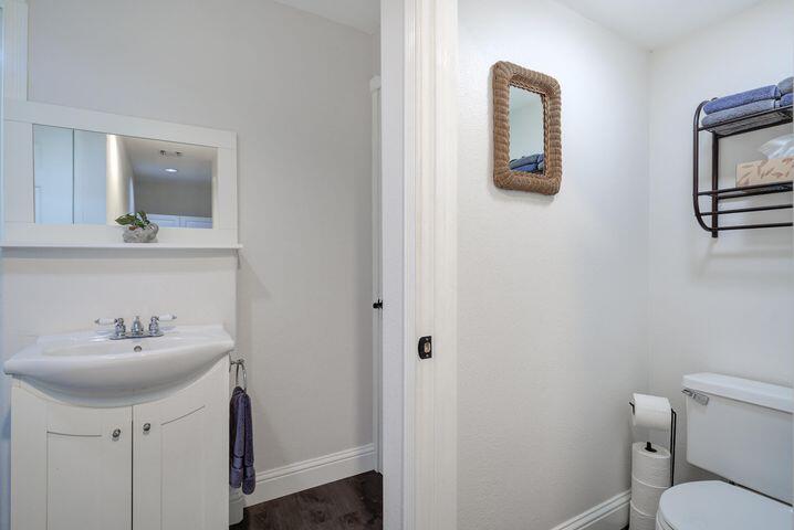 37105 Sapphire Road Burney, CA 96013 - Photo 27 of 39 a bathroom with a toilet sink and mirror