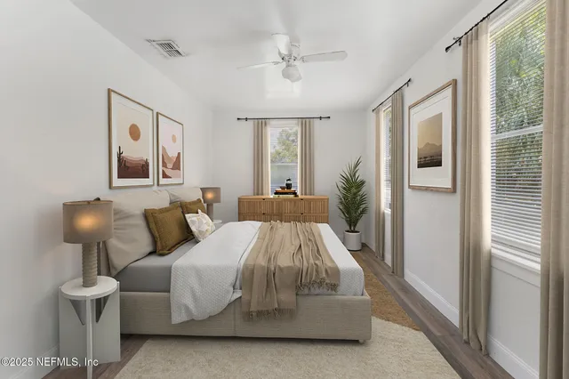 a bed room with a bed and a lamp