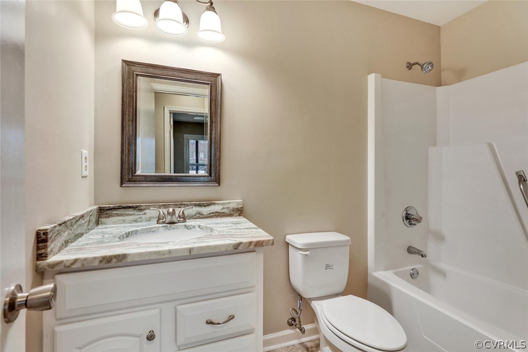 9817 Brenspark Road Chesterfield, VA 23832 - Photo 11 of 17 a bathroom with a granite countertop toilet sink and mirror