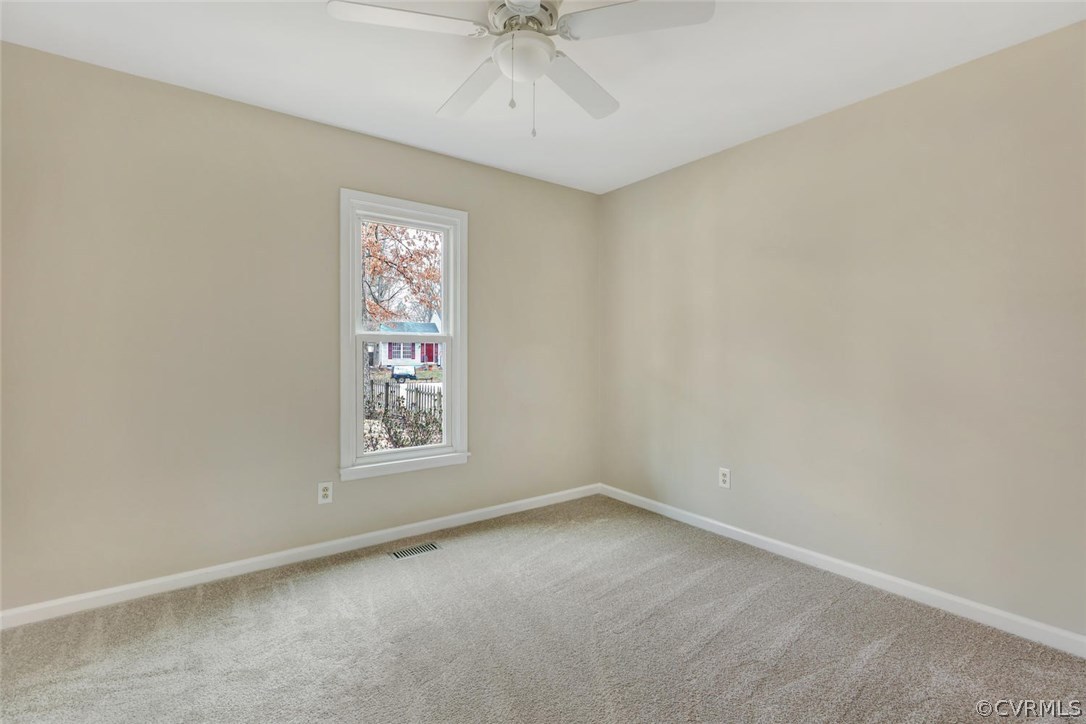 9817 Brenspark Road Chesterfield, VA 23832 - Photo 12 of 17 an empty room with a window and a fan