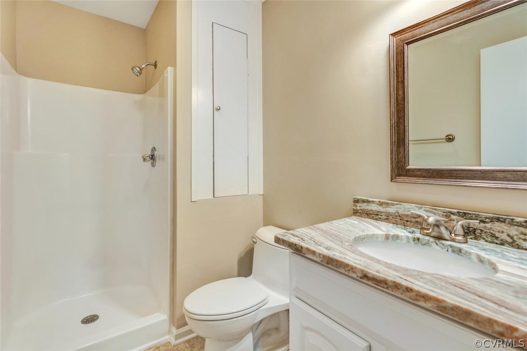 9817 Brenspark Road Chesterfield, VA 23832 - Photo 15 of 17 a bathroom with a granite countertop sink toilet and shower