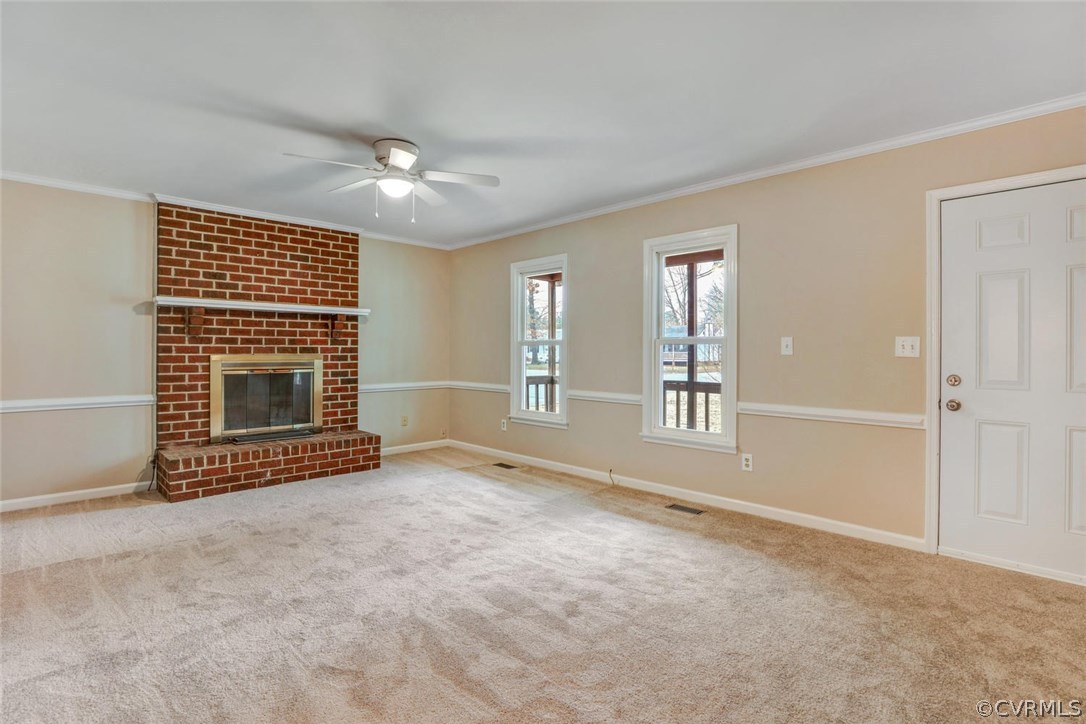 9817 Brenspark Road Chesterfield, VA 23832 - Photo 3 of 17 a view of an empty room with a fireplace and a window