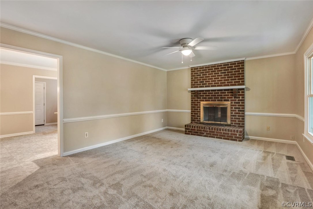 9817 Brenspark Road Chesterfield, VA 23832 - Photo 4 of 17 an empty room with fireplace and fan