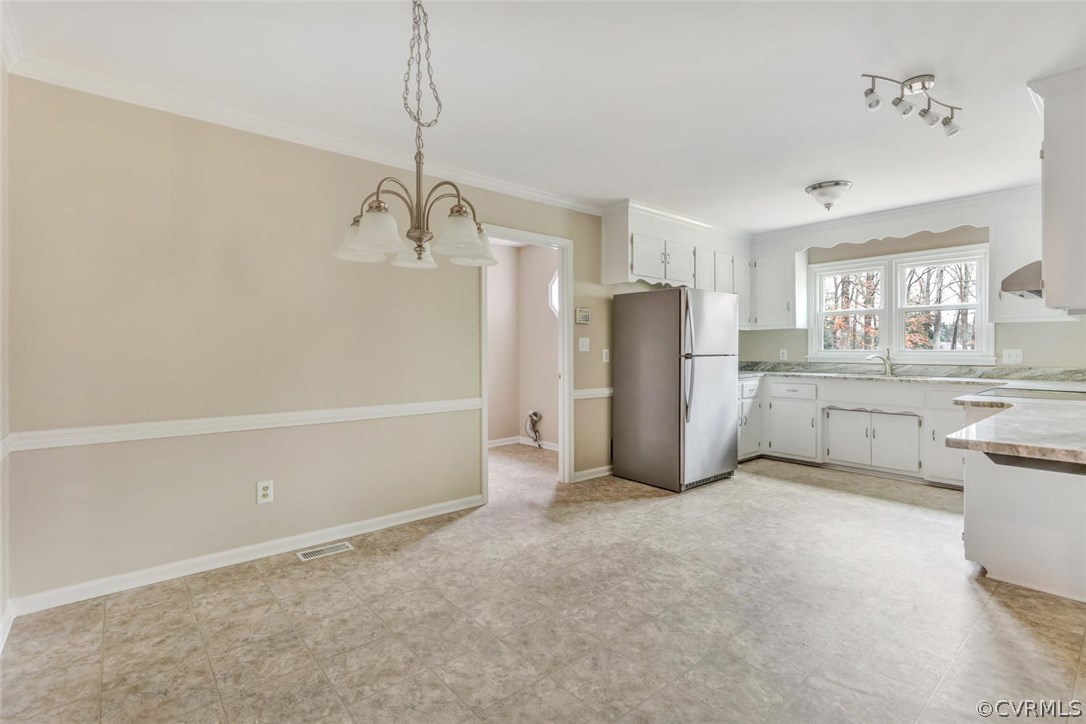 9817 Brenspark Road Chesterfield, VA 23832 - Photo 5 of 17 a view of a kitchen with a sink and a refrigerator