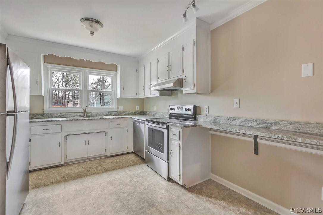 9817 Brenspark Road Chesterfield, VA 23832 - Photo 6 of 17 a kitchen with granite countertop white cabinets stainless steel appliances a sink and a window