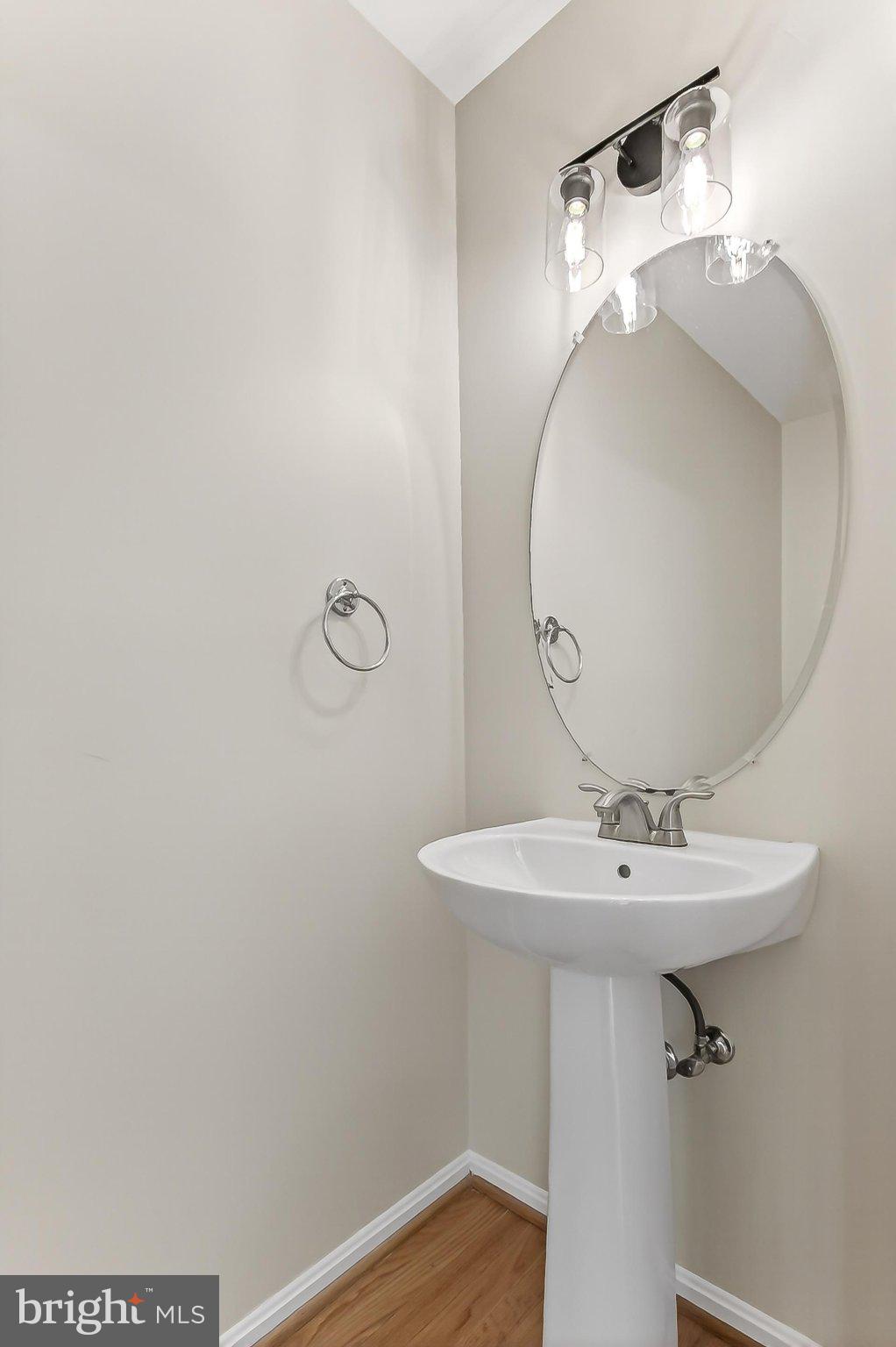 13157 Kidwell Field Road Herndon, VA 20171 - Photo 23 of 50 Sleek and modern powder room design.