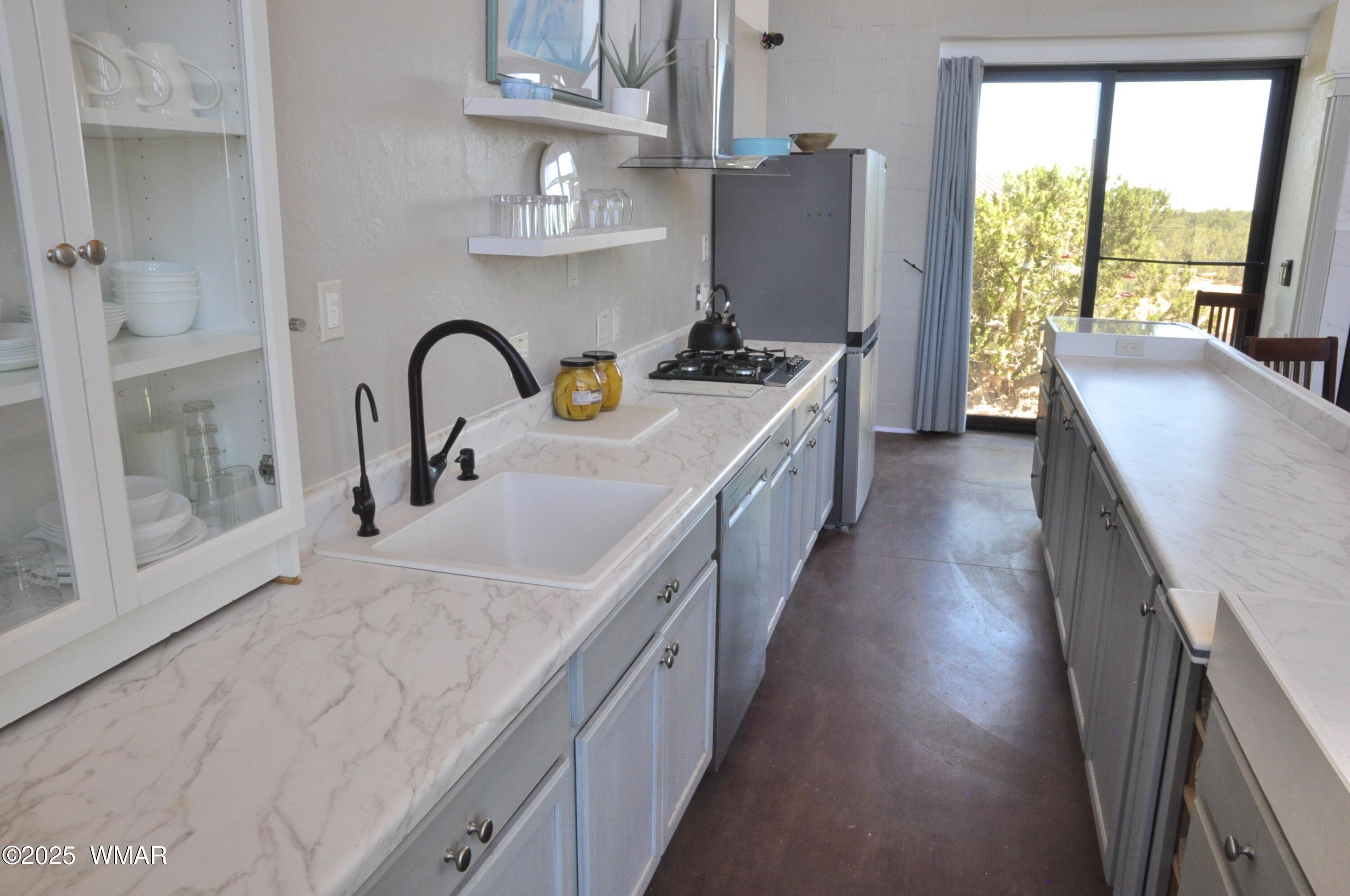 12 County Road Concho, AZ 85924 - Photo 9 of 85 Lots of Countertop Workspace in this Step-Saving Kitchen