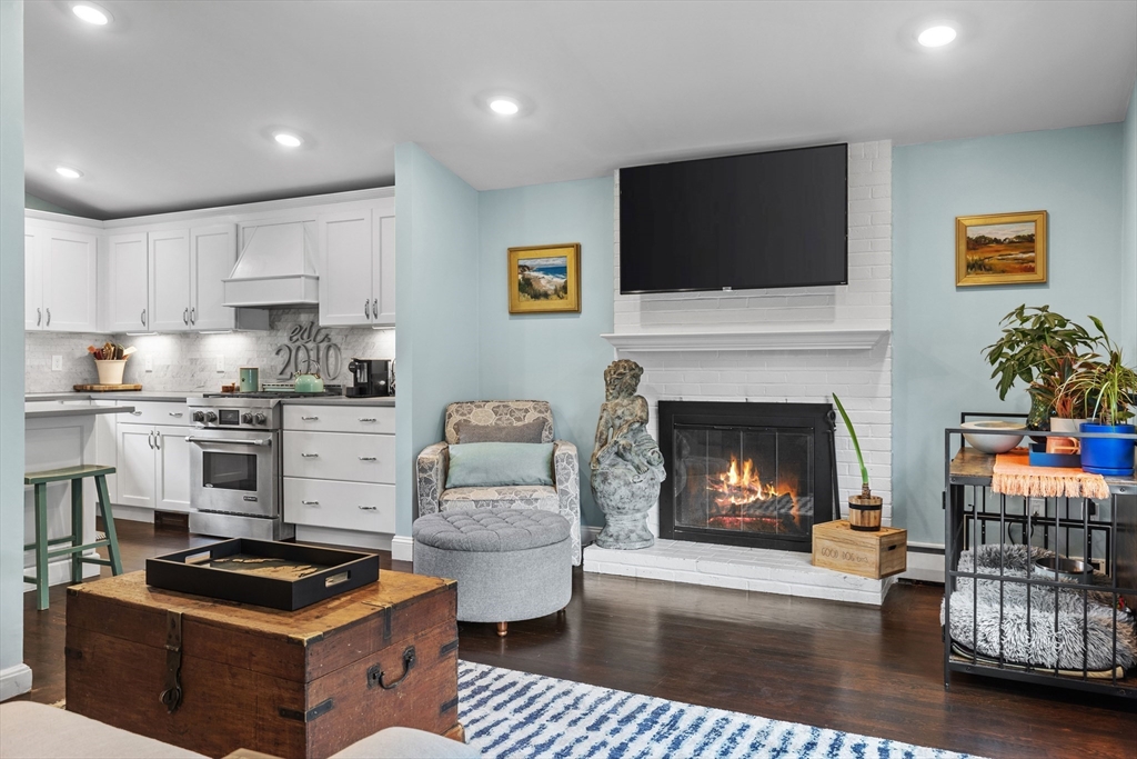 15 Ridgewood Road Westwood, MA 02090 - Photo 4 of 26 a kitchen with furniture and a fireplace