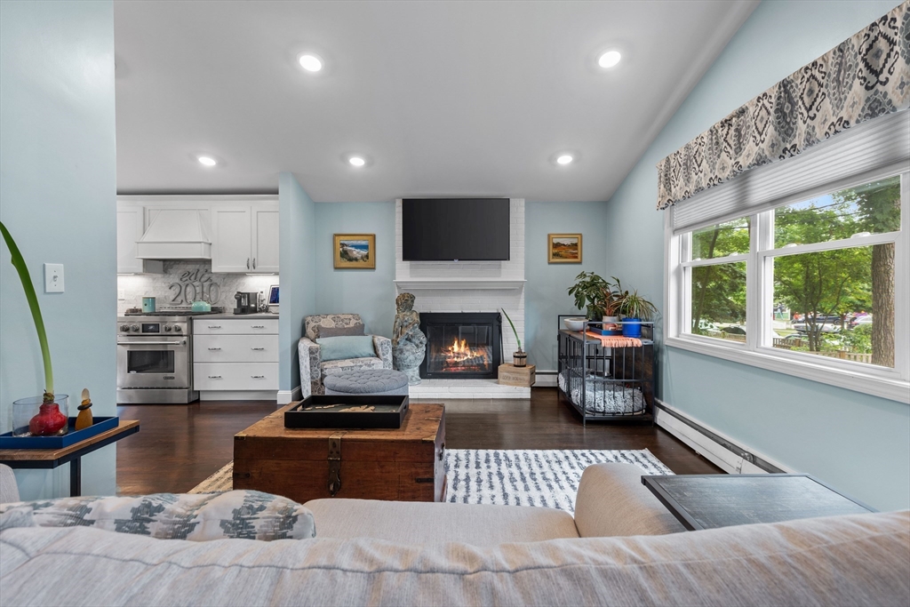 15 Ridgewood Road Westwood, MA 02090 - Photo 5 of 26 a living room with furniture and a fireplace
