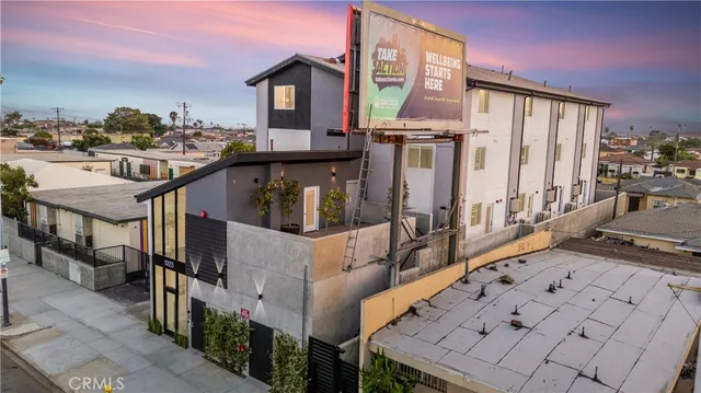 a view of a balcony with furniture and wooden floor