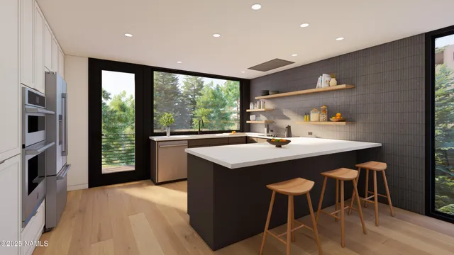 a kitchen with kitchen island a sink table and chairs