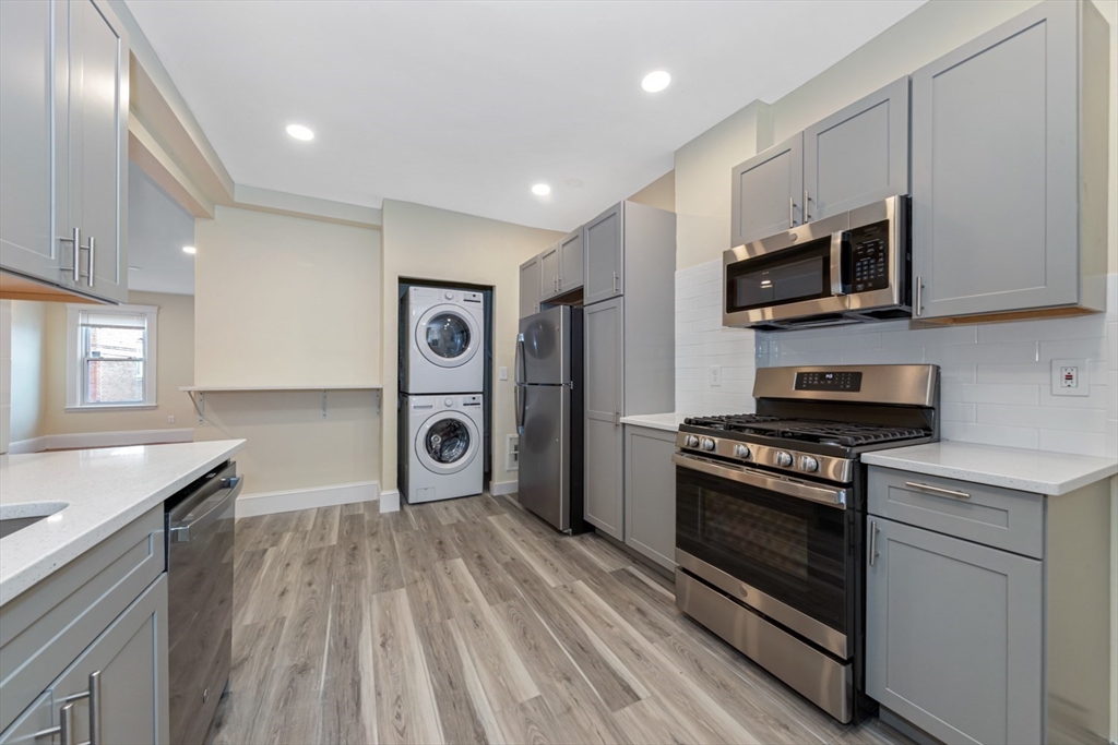 44 Brackett Street, Unit 3 Boston, MA 02135 - Photo 1 of 28 a kitchen with stainless steel appliances granite countertop a stove and a sink