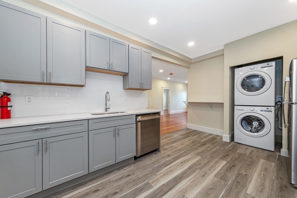 44 Brackett Street, Unit 3 Boston, MA 02135 - Photo 17 of 28 a kitchen with sink and cabinets