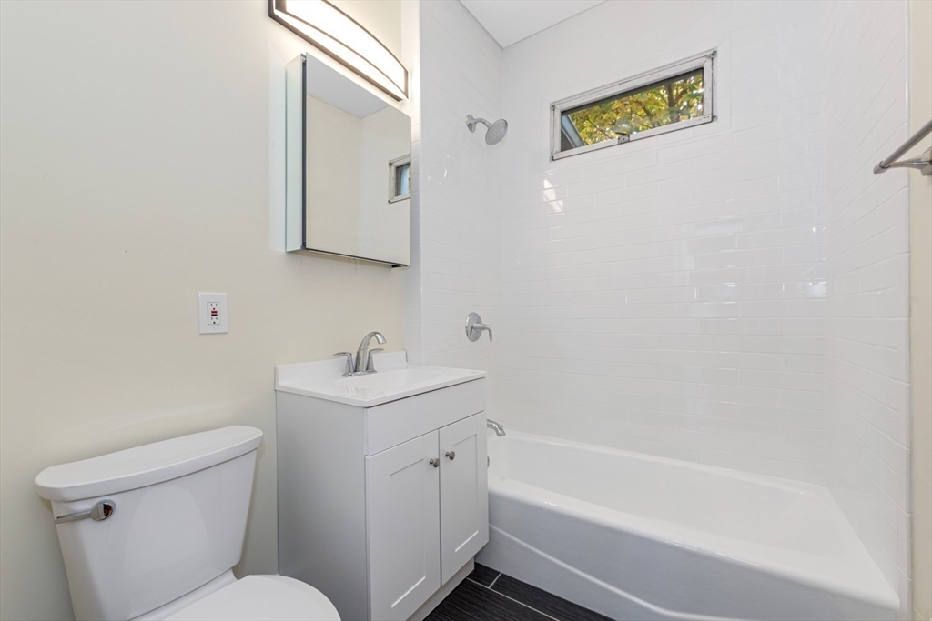 44 Brackett Street, Unit 3 Boston, MA 02135 - Photo 21 of 28 a bathroom with a sink a toilet and shower