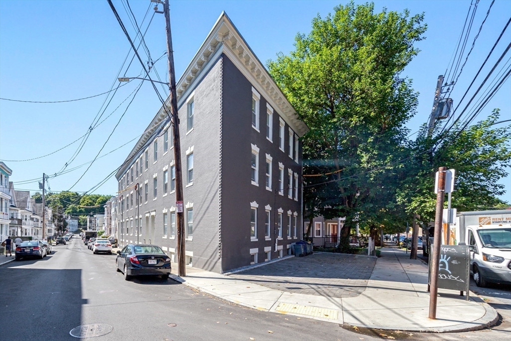 44 Brackett Street, Unit 3 Boston, MA 02135 - Photo 22 of 28 a view of a street with cars
