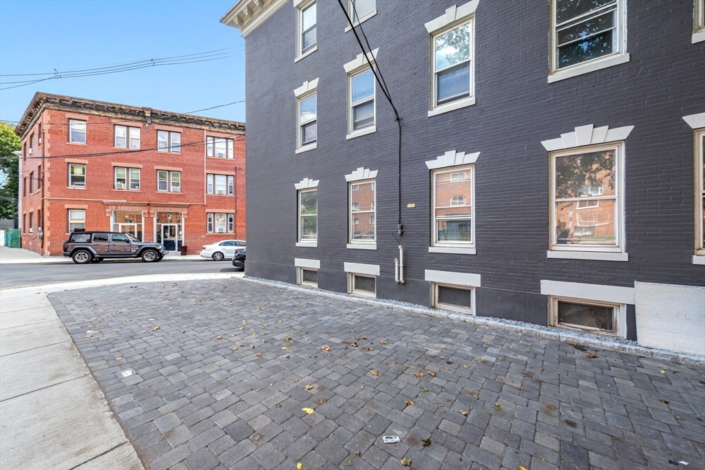 44 Brackett Street, Unit 3 Boston, MA 02135 - Photo 25 of 28 a view of building with a street