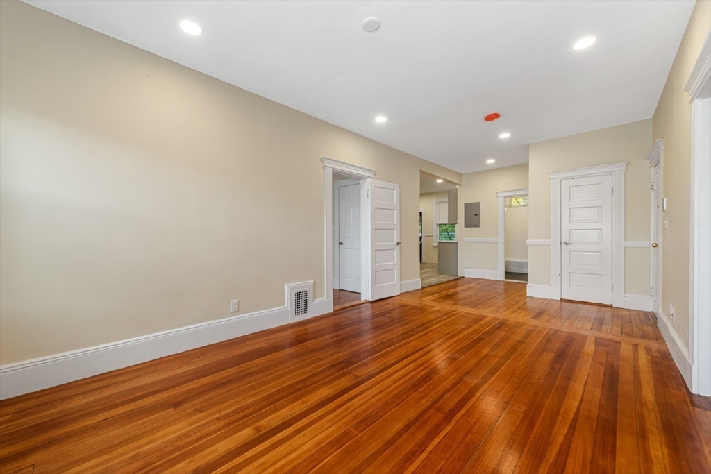 44 Brackett Street, Unit 3 Boston, MA 02135 - Photo 4 of 28 a big room with wooden floor and closet area