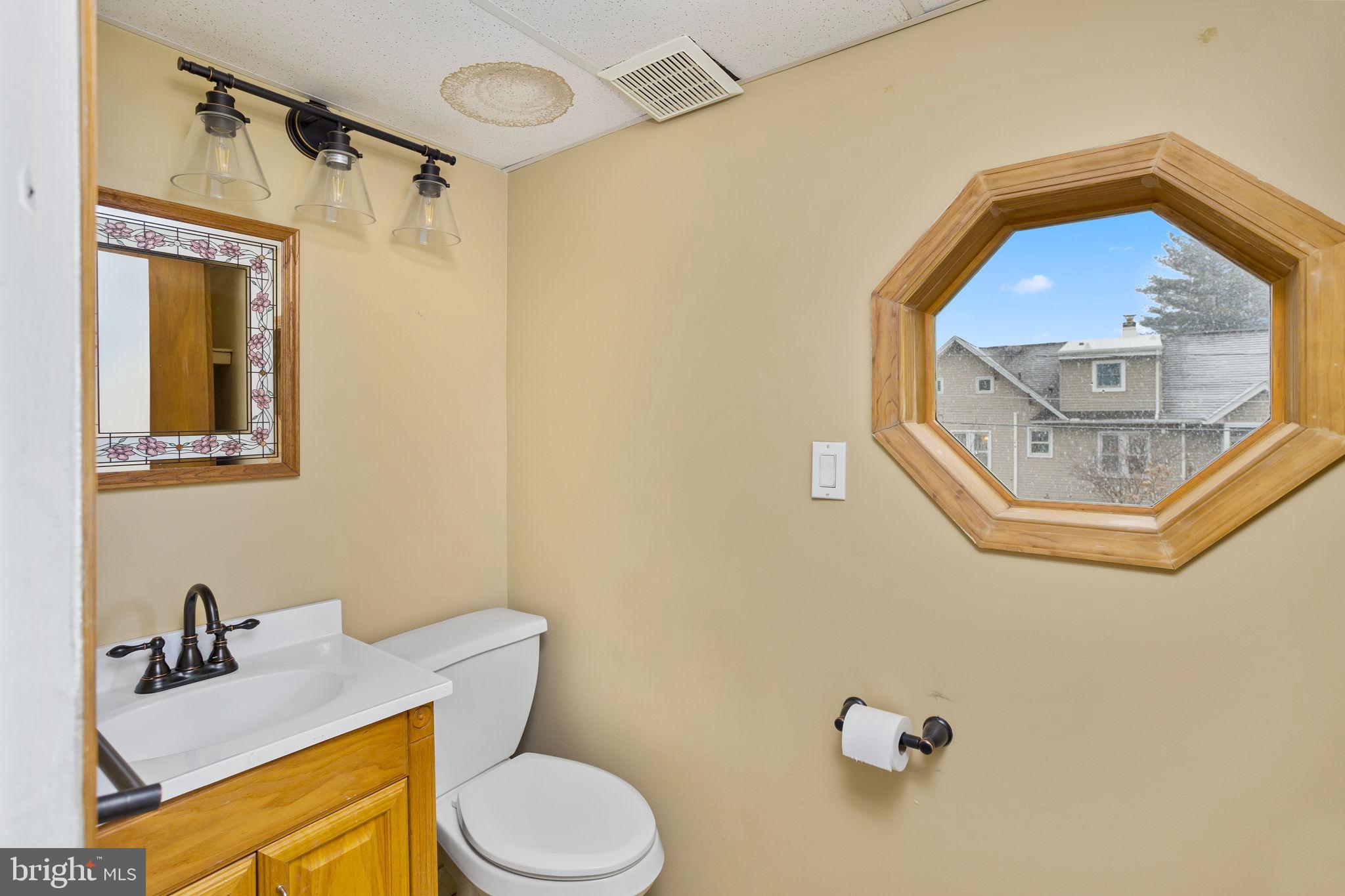 400 Reading Avenue Barrington, NJ 08007 - Photo 13 of 35 a bathroom with a toilet sink vanity tub and mirror
