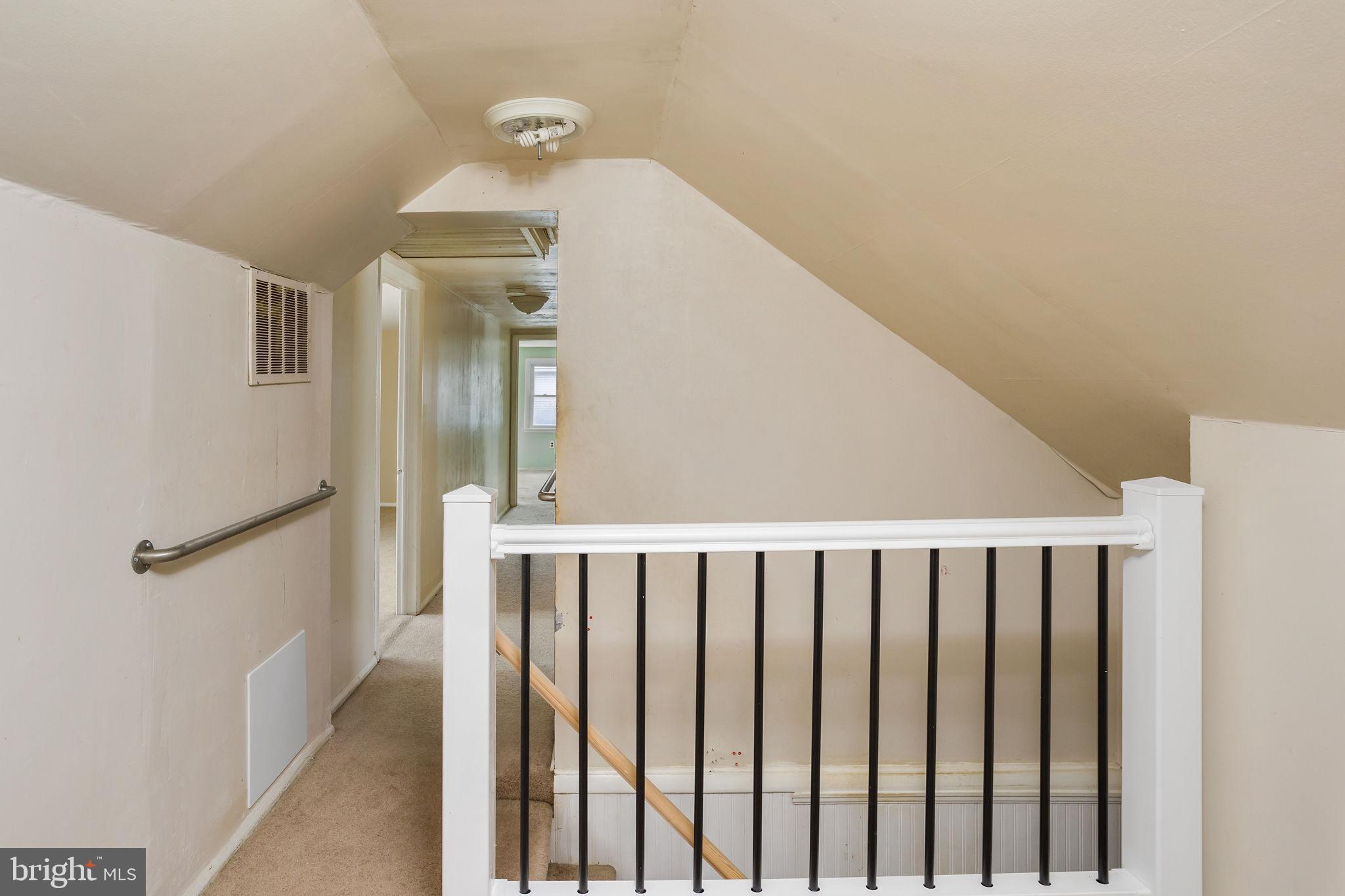 400 Reading Avenue Barrington, NJ 08007 - Photo 14 of 35 a view of a hallway with wooden floor and staircase