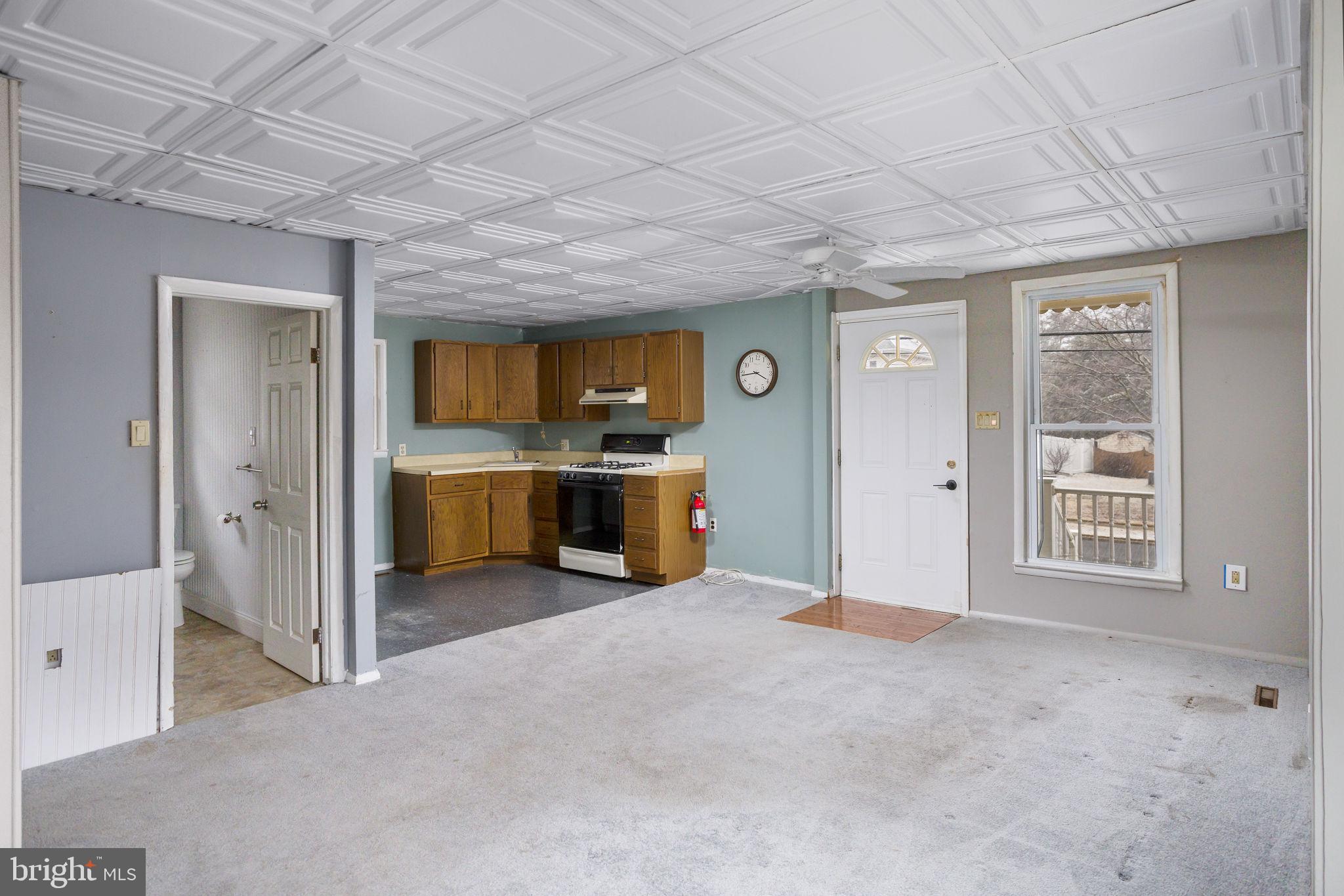 400 Reading Avenue Barrington, NJ 08007 - Photo 22 of 35 a view of a kitchen with a sink and a fireplace