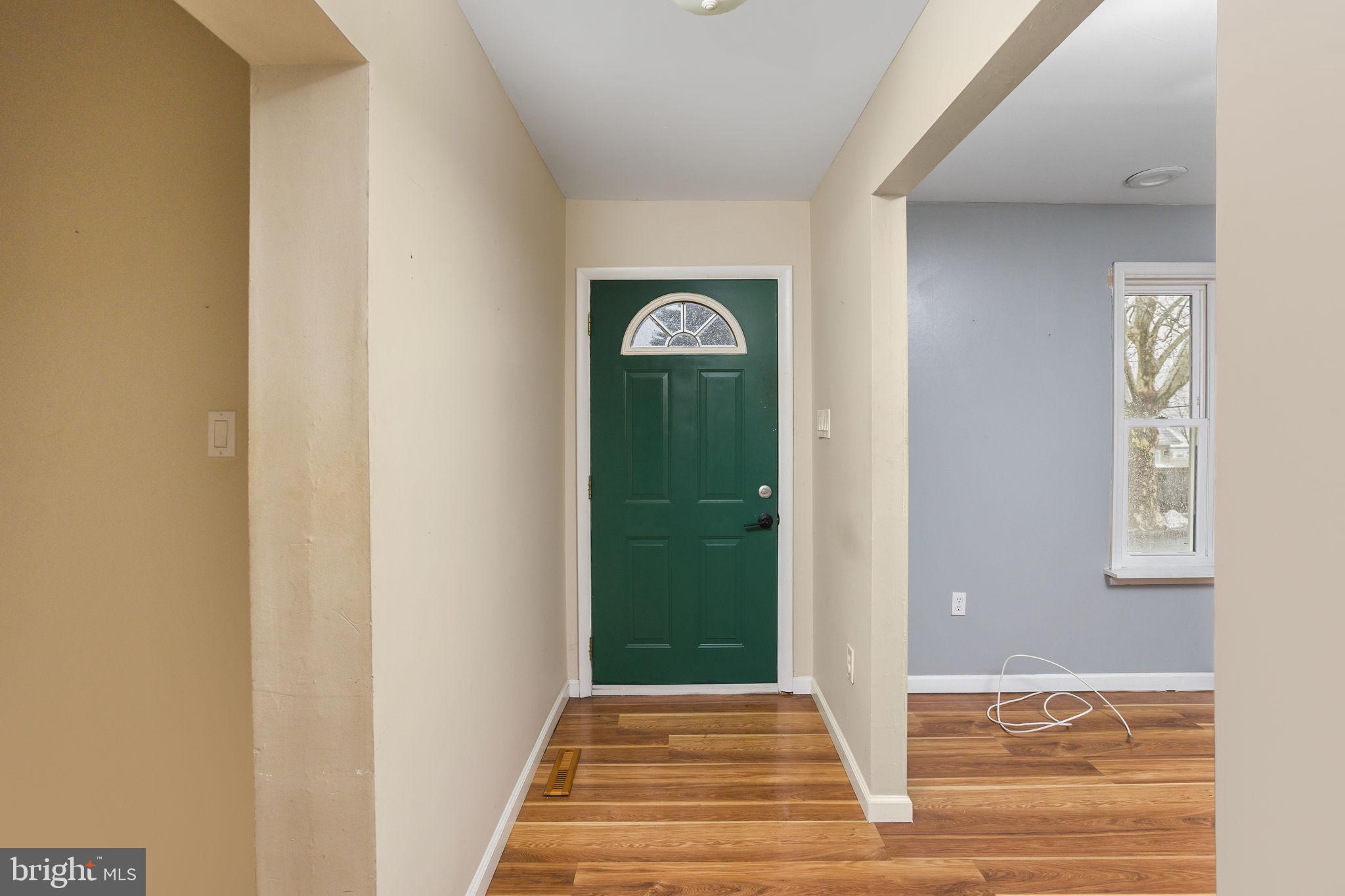 400 Reading Avenue Barrington, NJ 08007 - Photo 6 of 35 a view of a hallway to a house with a door