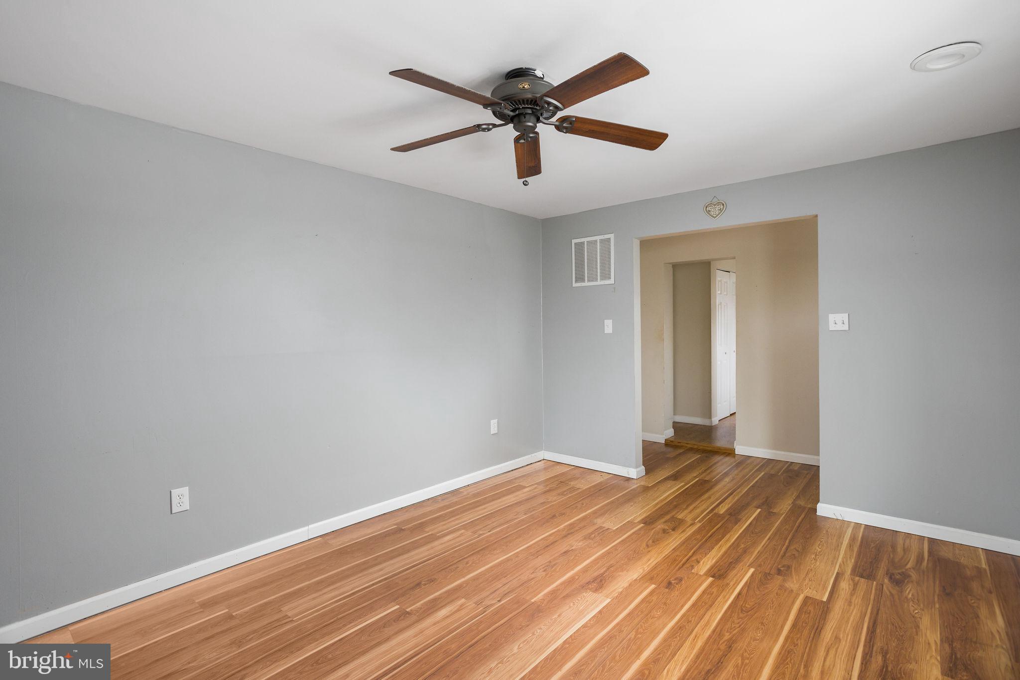 400 Reading Avenue Barrington, NJ 08007 - Photo 8 of 35 wooden floor in an empty room with a window