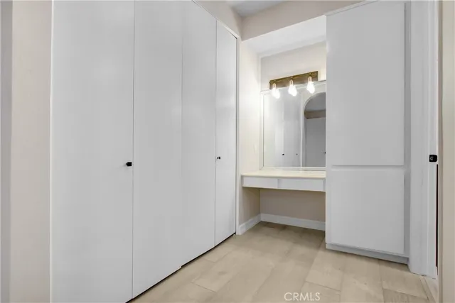 a spacious bathroom with a double vanity sink mirror and toilet
