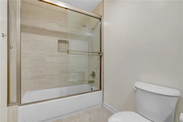 a bathroom with a glass shower door