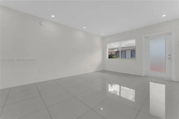 a view of an empty room with a window