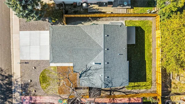 an aerial view of a house with a yard