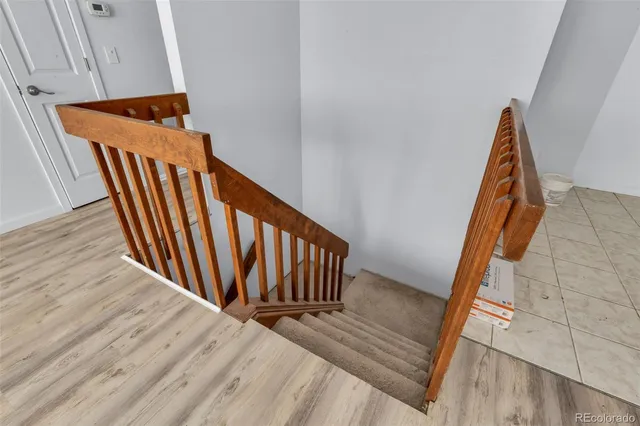a view of a room with wooden floor and windows